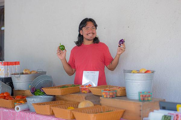 vegetable stand with worker